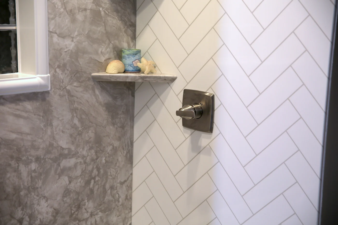 Gorgeous white herringbone shower wall surround by Bay State Bath in Pembroke, MA