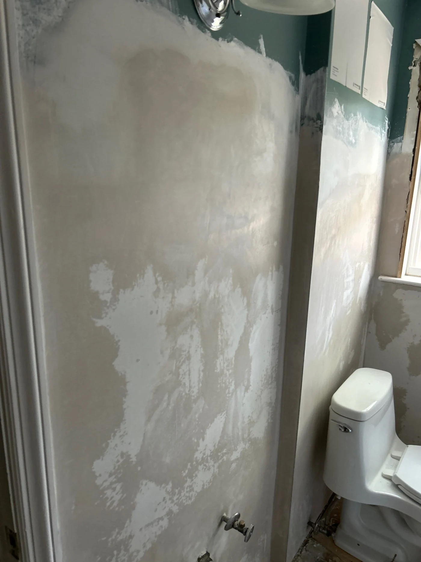 Plastered walls ready for paint during five-day bathroom remodel in Warwick, RI