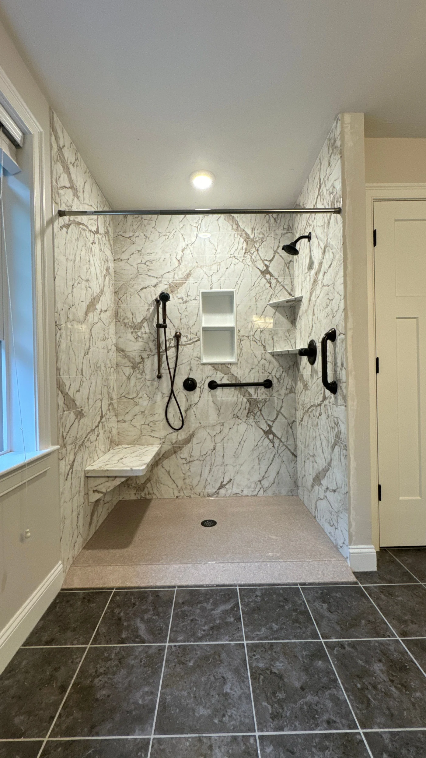 Shower remodel with handicap roll in ramp done by Bay State Bath in South Shore Boston