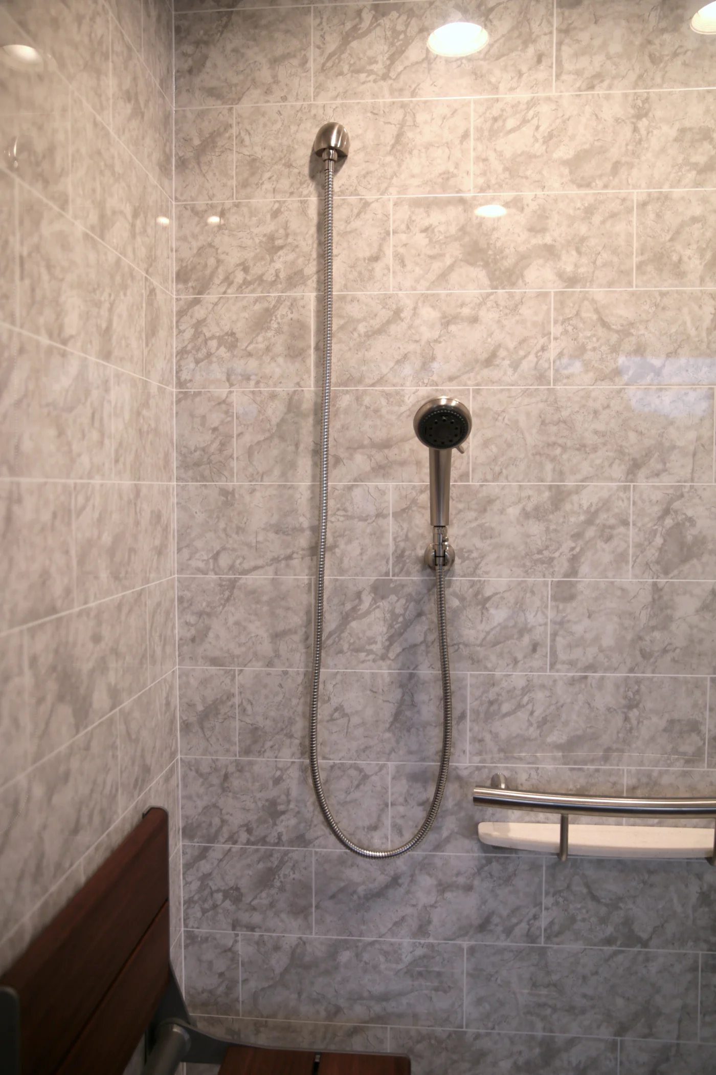 Safety features by INVISIA in bath wall surround remodel in Pembroke, MA