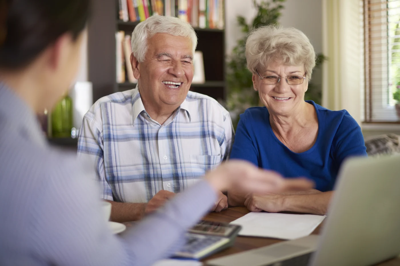 Older couple sits with Bay State Bath sales consultant before bath remodel