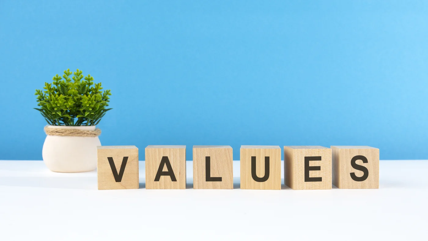 Values written out in wood blocks with blue background