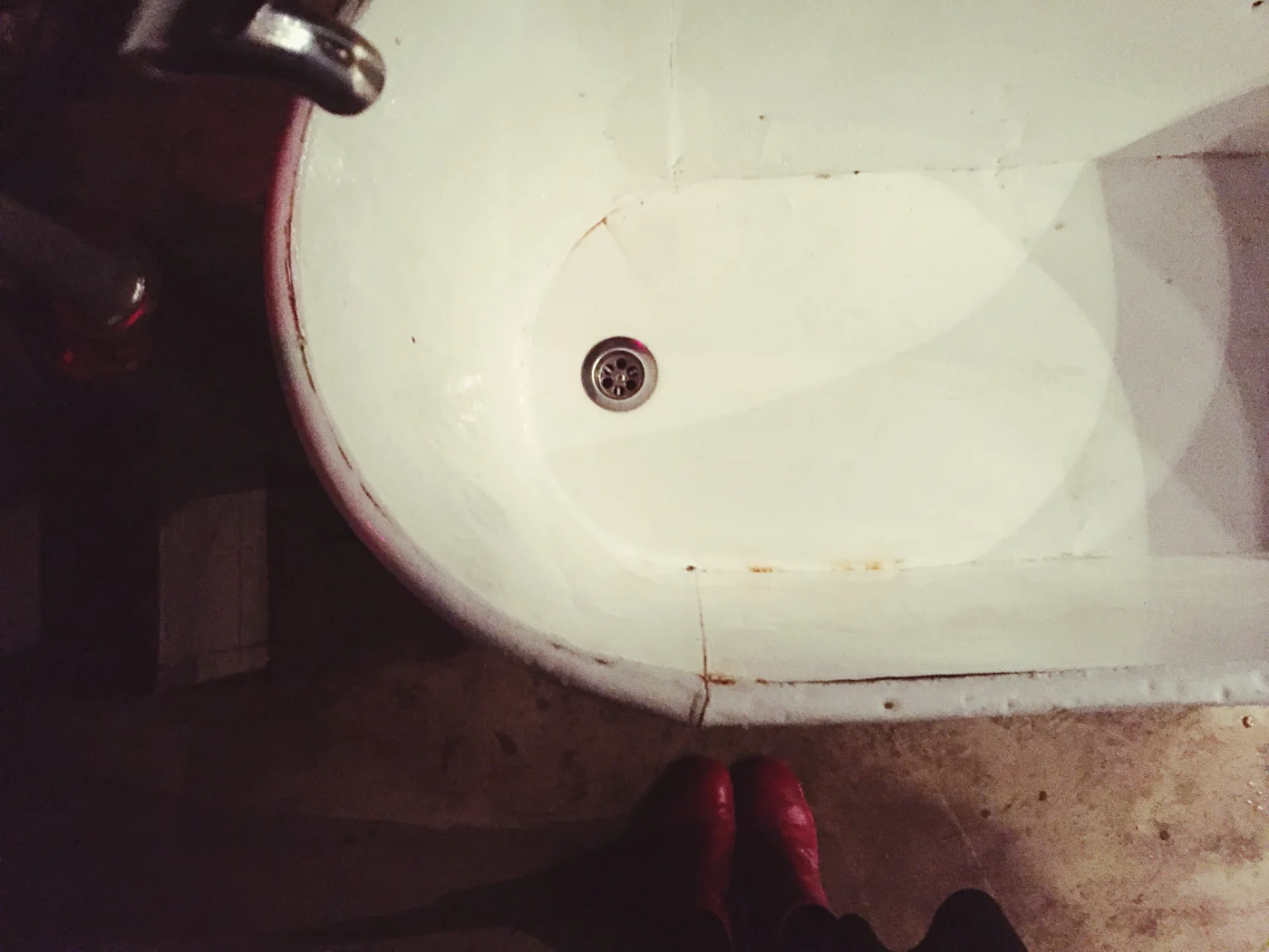 Old, rusty, damaged tub that needs replacement