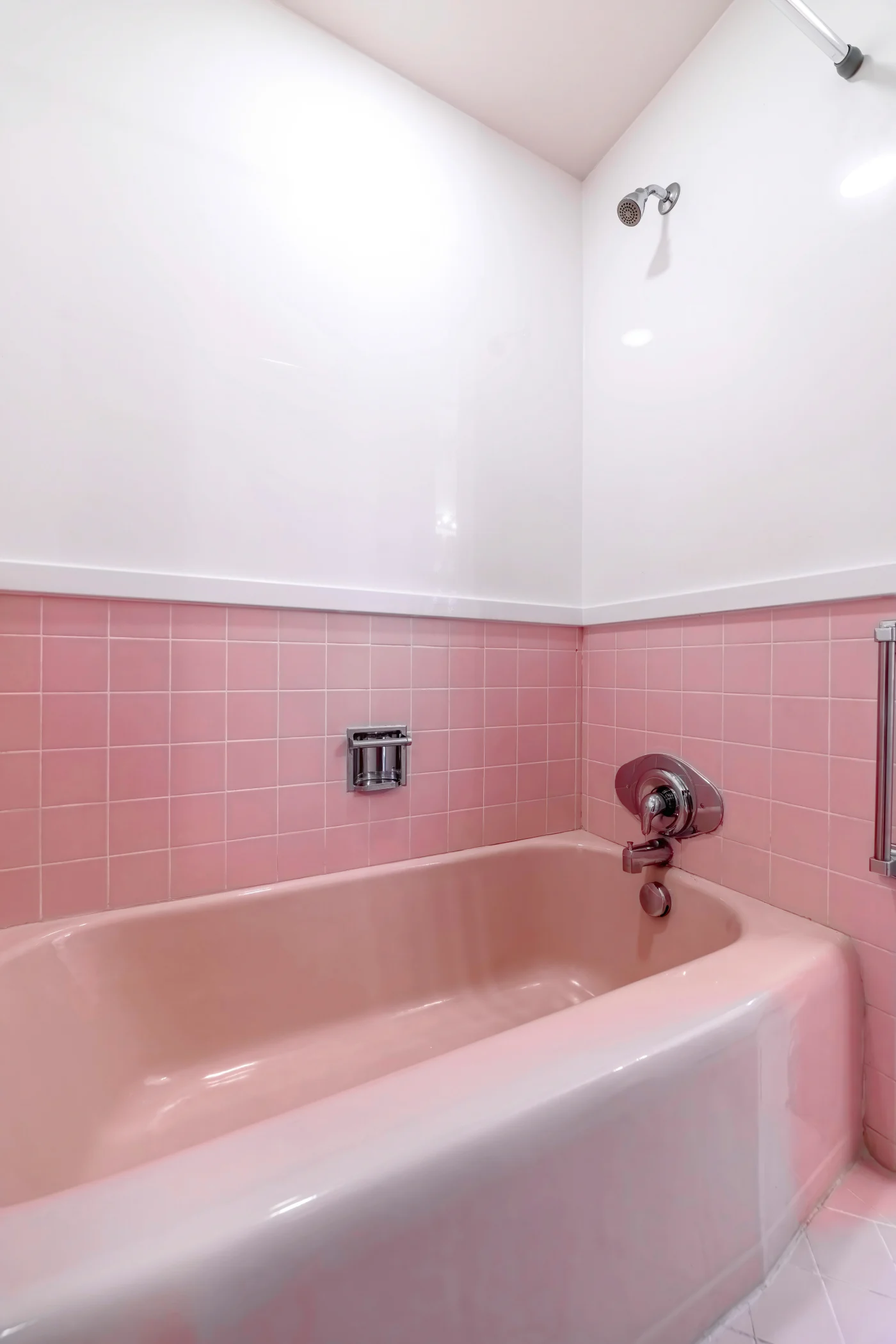 Outdated pink bathtub in South Shore Boston bathroom that needs to be replaced