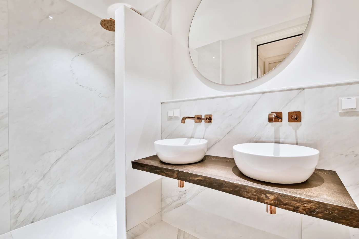 A double vanity with white basin sinks in a remodeled Weymouth, MA bathroom