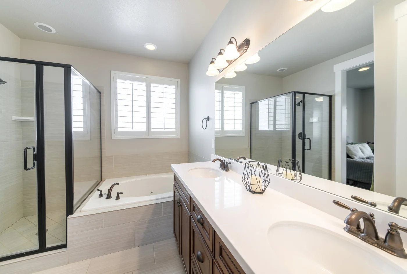 Interior Of A Master Bathroom With Double Vanity Sink And Windows