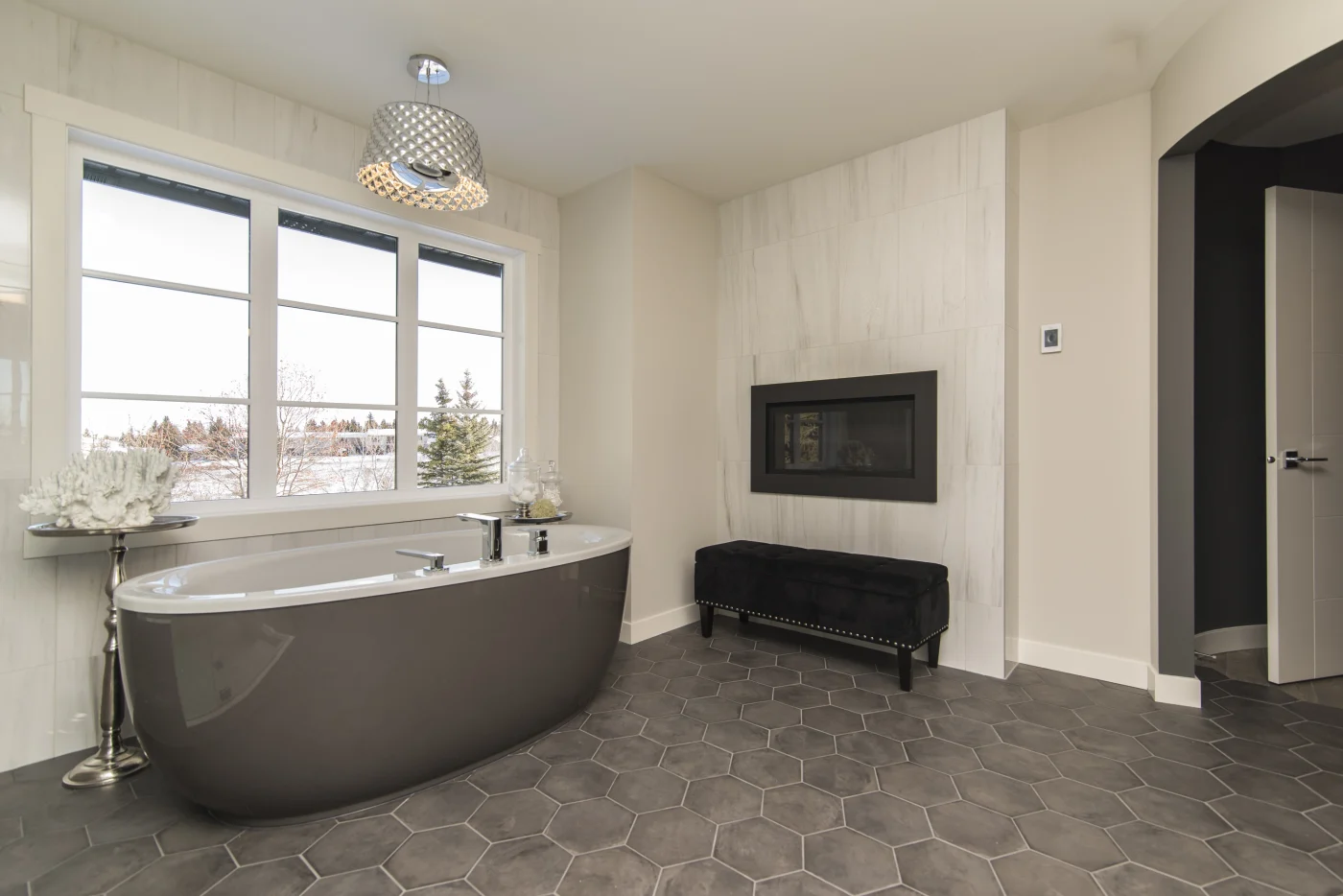 A modern bathtub remodel in Peabody, MA with a black outside color