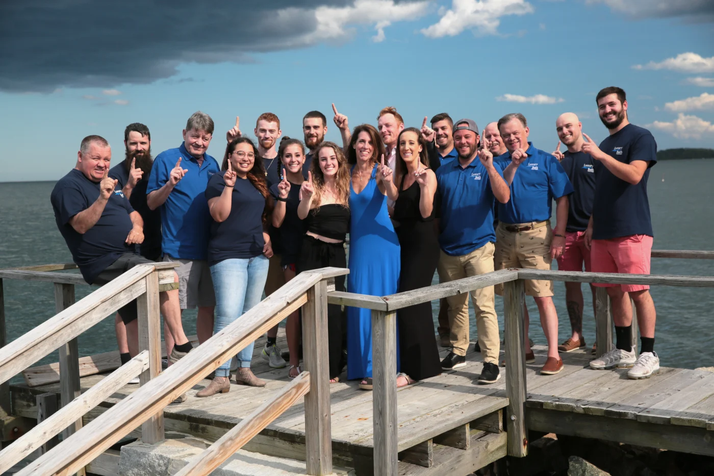 The tub-to-shower conversion team in Plymouth, MA taking an outdoor group photo.