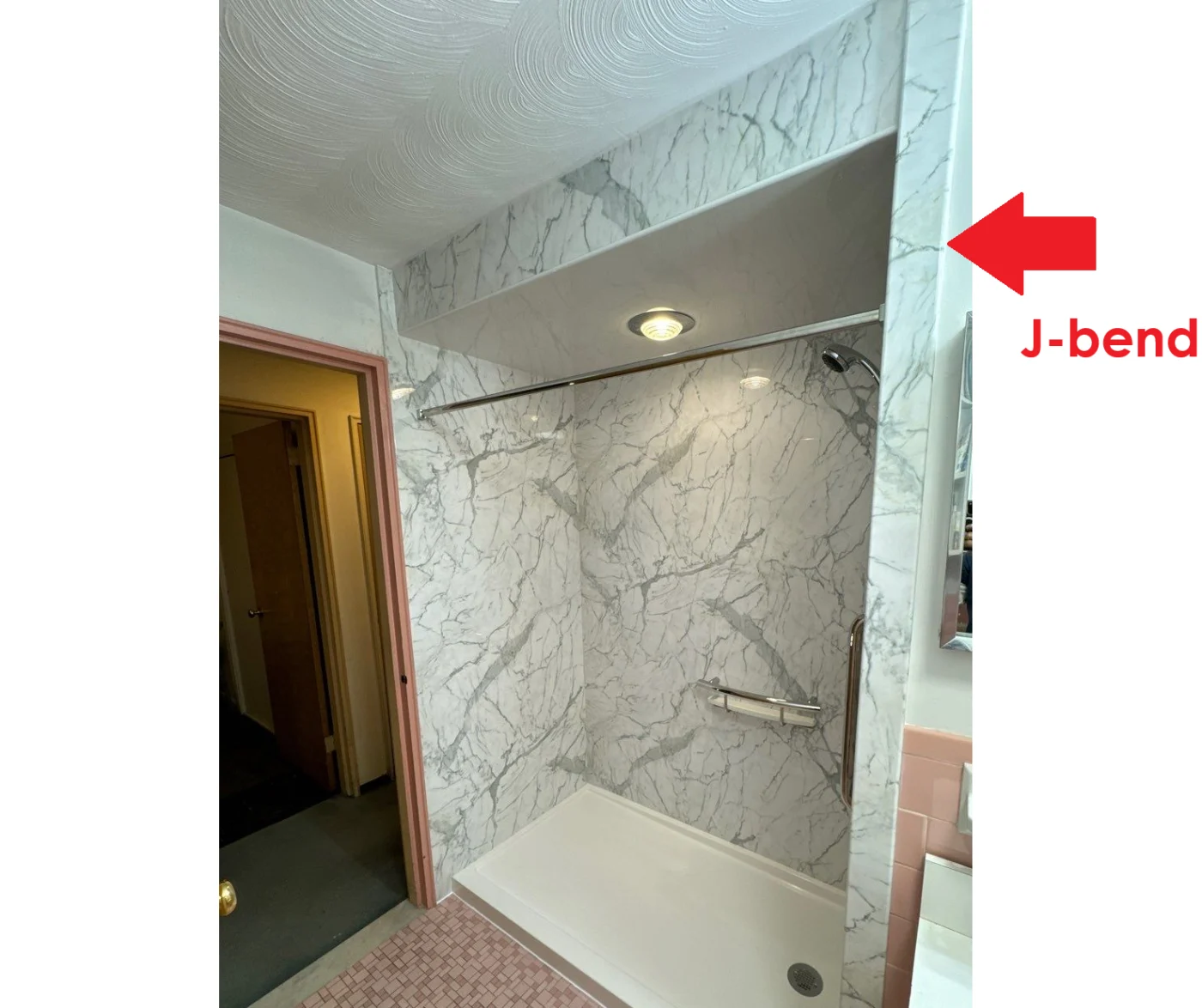 Shower remodel showing a j-bend around a wall corner