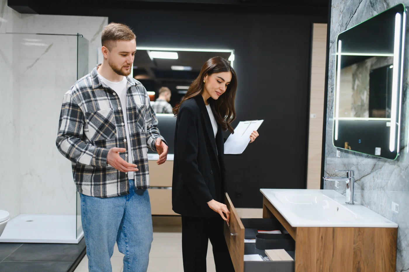 Couple Choosing Bathroom Furniture In Home Improvement Showroom